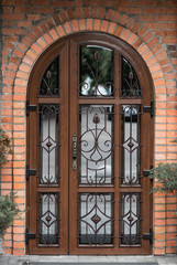 antique arched door with mirror inserts
