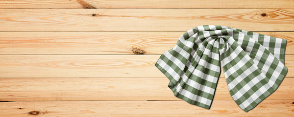 Fototapeta na wymiar Empty wooden deck table with napkin tablecloth