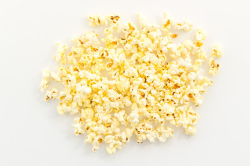 Popcorn scattered on white background top view