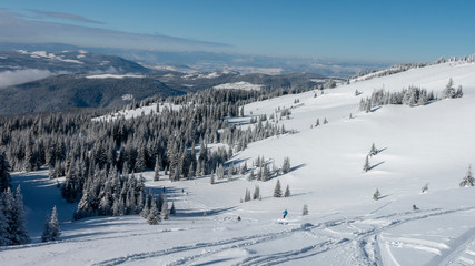 Fototapeta na wymiar Scenic view of snow covered mountainside at ski resort, Sun Peaks Resort, Sun Peaks, British Columbia, Canada