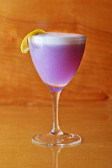 Fresh Fruit Juice Smoothie Cocktail with Lemon Garnish and Straw