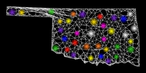 Web mesh vector map of Oklahoma State with glare effect on a black background. Abstract lines, light spots and spheric points form map of Oklahoma State constellation.