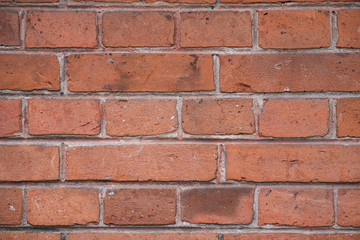 Wall of red brick photo close