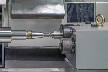 Screw lathe machine, lathe threading machine, turning machine cutting screw threads on a lathe tool processing in a workshop.