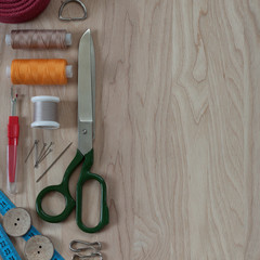 tailor's scissors, sewing threads and other tailor's accessories are prepared for cutting and sewing