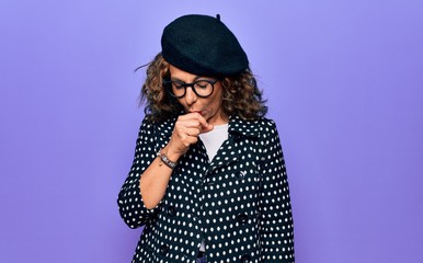 Middle age beautiful woman wearing casual jacket and french beret over purple background feeling unwell and coughing as symptom for cold or bronchitis. Health care concept.