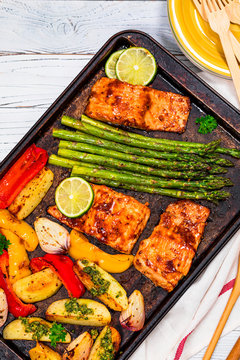 Sheet Pan Baked Salmon Fish With Roasted Asparagus, Potatoes And Bell Pepper Dinner. Selective Focus. 