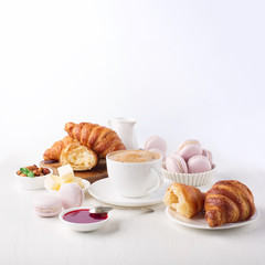Fresh delicious breakfast with coffee and  croissants