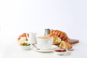 Fresh delicious breakfast with coffee and  croissants