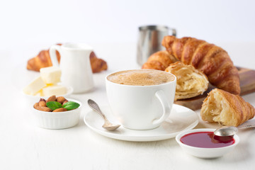 Fresh delicious breakfast with coffee and  croissants