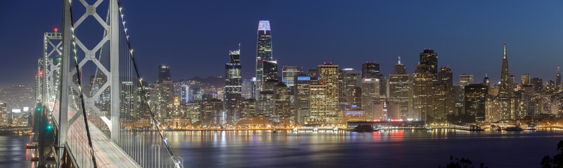 Panoramic Views of San Francisco Bay Bridge and Waterfront at Night. Yerba Buena Island, San...