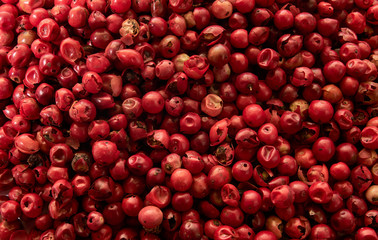Pink pepper peas top view, texture, background