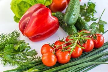 different types of vegetables on a white background top view. vegan products. peppers, cabbage, tomatoes, cucumbers, various herbs. vegetable diet.