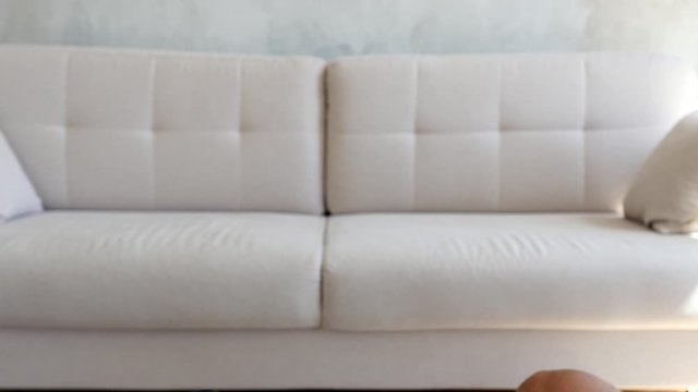 Athletic Caucasian men and a woman go in for sports, push ups, squats, lunges, standing in the room. Funny couple of black man and woman exercising at home near the sofa. Indoor pair training at home