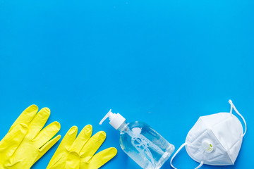 Gloves, soap, facial mask - coronavirus prevention - from above copy space