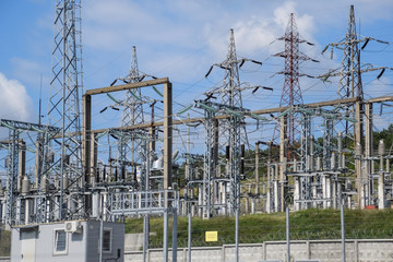 Power substation equipment, transformers and wire poles.