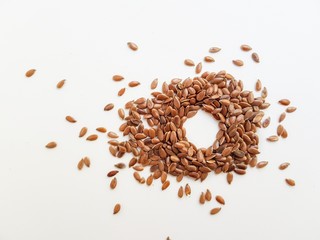 Flax seeds close-up on a white background.