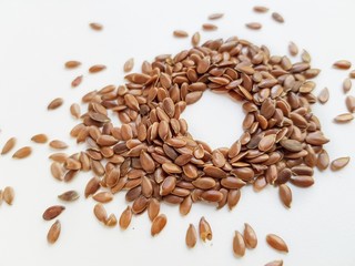 Flax seeds close-up on a white background.