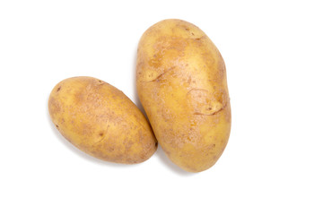 Several potato tubers on a white isolated background. Flat lay. Fresh vegetables. Yellow potatoes.