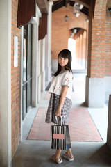 Asian Young woman with shopping bag in normal lifestyle at urban city