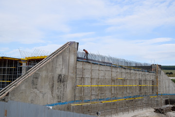 Fototapeta premium Reinforced concrete construction road junction. Road construction and bridges.