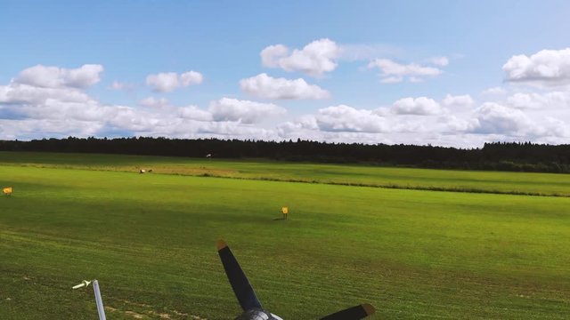 Light plane on green air field. Jet, aerial top view 4k