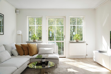 Scandinavian style interior. Living room with bright colors on a sunny summer day.  - obrazy, fototapety, plakaty