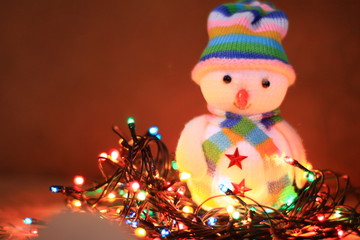 snowman christmas toys and colourful lights