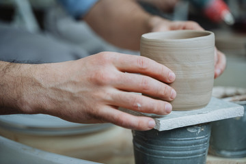 Potter's wheel, pottery workshop, working with clay, clay, clay modeling, modeling, ceramics, hands made of clay, clay pot, stained in clay, dirty hands, creativity, workshop, hands, planters