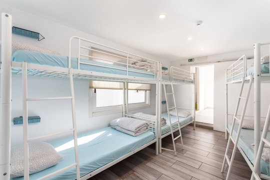 Clean bedroom with bunk beds in a hotel, a hostel for tourists.