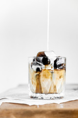 Iced coffee with milk and ice.