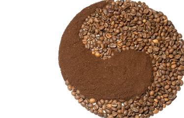 Yin-yang composed of whole and ground coffee on a white background