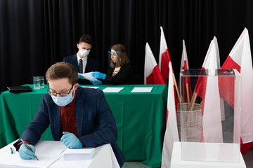 The voter sat down to the table and begins to mark his ideal presidential candidate.