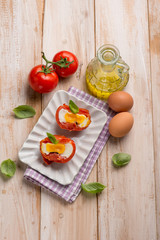 tomatoes filled with eggs and basil