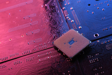 Computer cpu processor chip on circuit board ,motherboard background. Close-up. With red-blue...