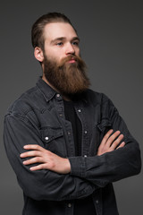 Attractive long beard man hands crossed isolated grey background
