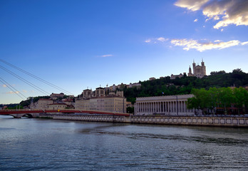 Obraz premium The Basilica of Notre Dame de Fourviere overlooking Lyon, France and the Saone River.