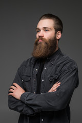 Attractive long beard man hands crossed isolated grey background