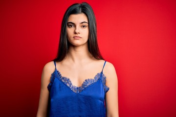 Fototapeta premium Young beautiful brunette woman wearing elegant and comfortable lingerie underwear with serious expression on face. Simple and natural looking at the camera.
