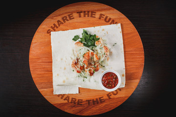 chicken breast skewer on a Board with sauce