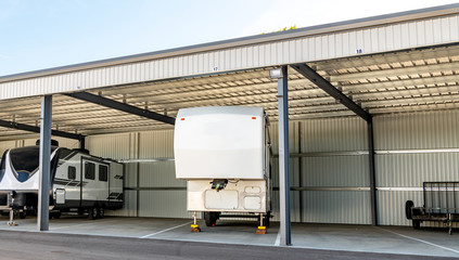 Personal Recreational vehicle parked beneath a storage facility