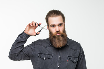 Barber scissors, barber shop. Brutal man, moustache male in barbershop, haircut, shaving. Mans...