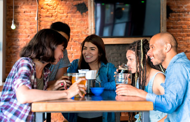 A group of friends drinking together in a bar