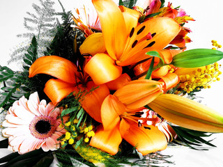 Orange bouquet of flowers lily, mimosa, gerbera isolated.