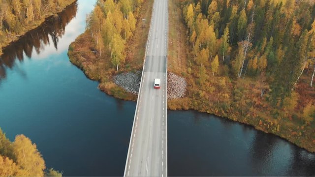 Aerial shot of van on scandinavian road