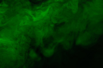 Green steam on a black background.