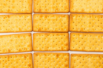 Cracker with salt isolated on white.