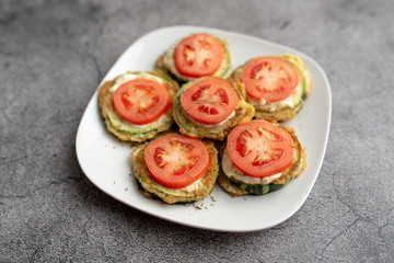 Fried zucchini with tomato dill mayonnaise and garlic sauce. Russian, European appetizer 