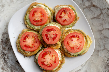 Fried zucchini with tomato dill mayonnaise and garlic sauce. Russian, European appetizer 
