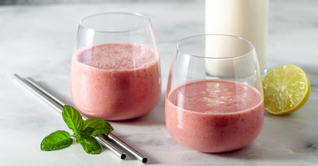 banner of morning sweet breakfast smoothie based on oat milk, banana and raspberries, with lime juice